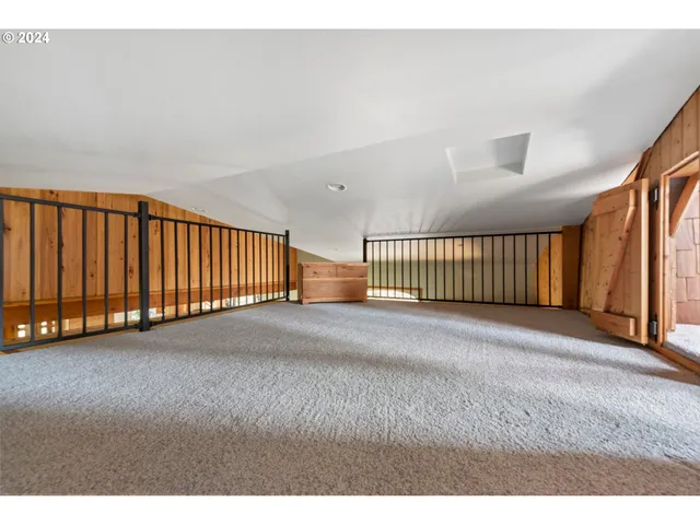 a front view of a house with a yard and fountain in middle