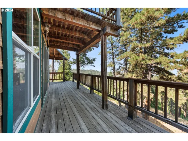 a view of balcony with wooden floor