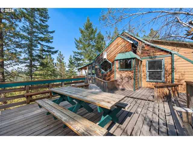 a view of a wooden chairs and table on the wooden floor