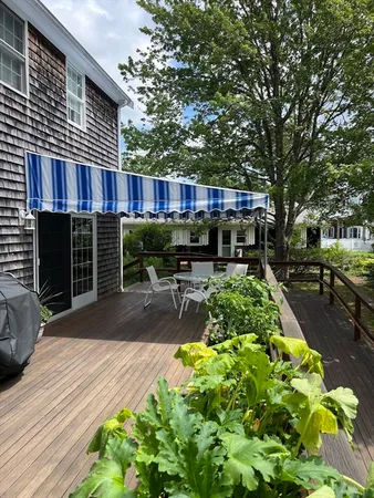 a view of backyard with swimming pool and outdoor seating