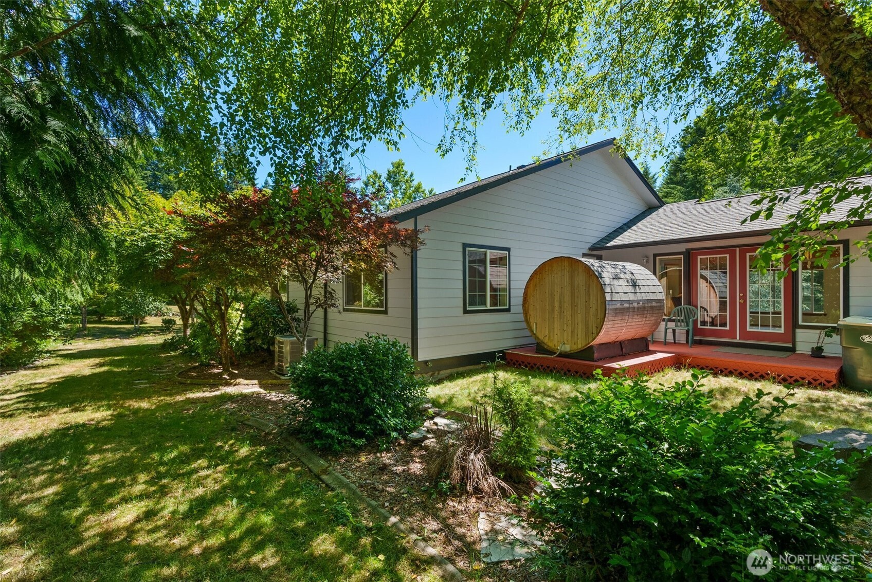 104 Walsh Lane Chehalis, WA 98532 - Photo 20 of 30 a backyard of a house with table and chairs under an umbrella