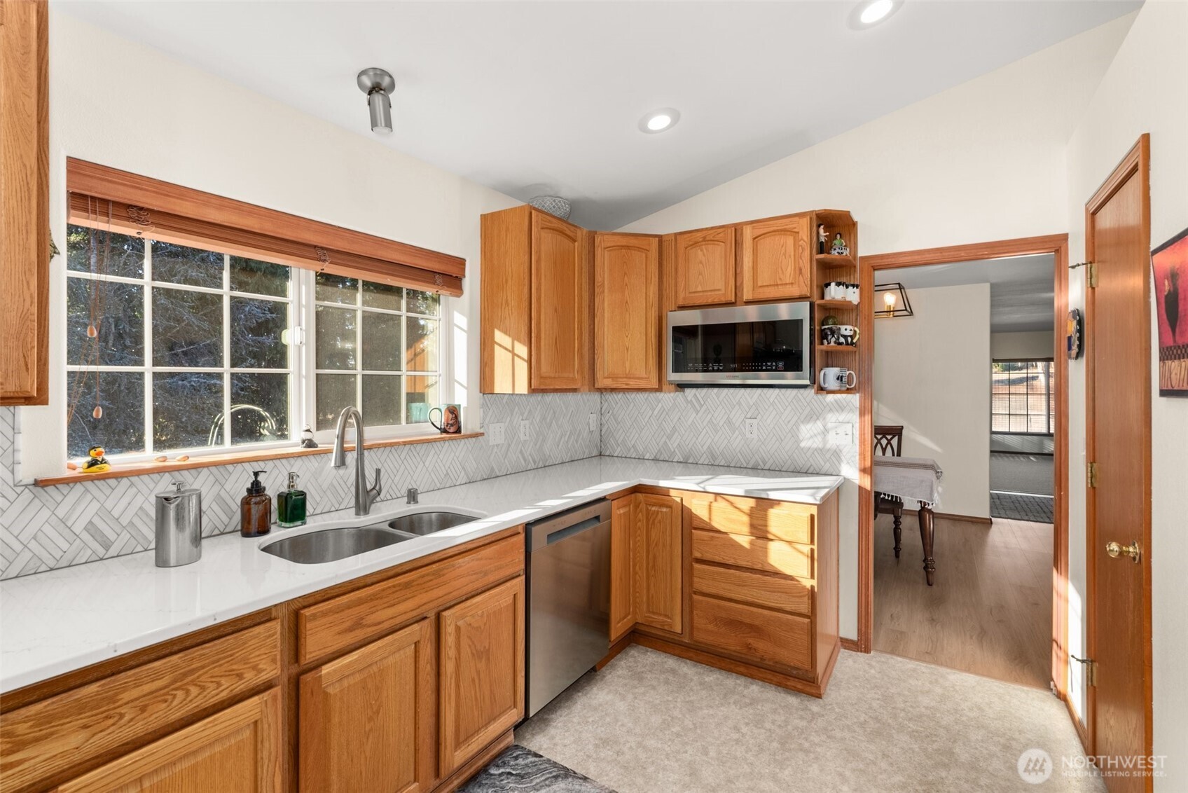 104 Walsh Lane Chehalis, WA 98532 - Photo 7 of 30 a kitchen with stainless steel appliances granite countertop a sink and a stove