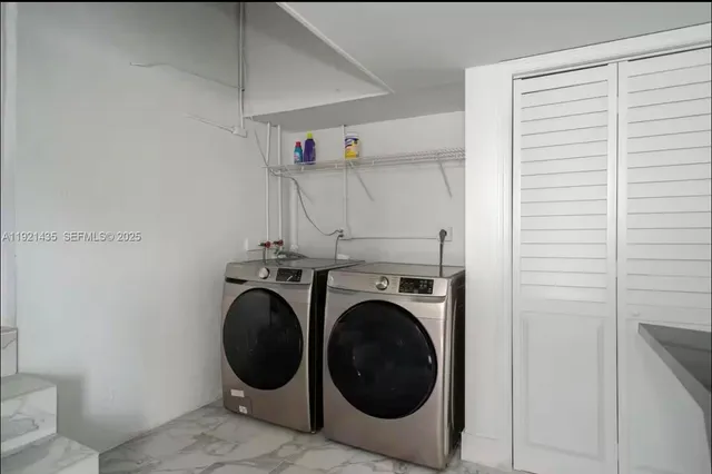 a utility room with dryer and washer