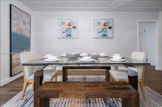 a living room with granite countertop furniture and wooden floor