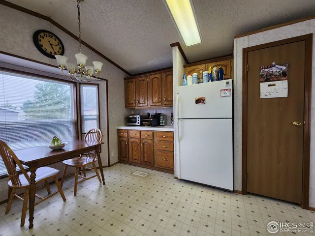 a white refrigerator freezer sitting in a kitchen
