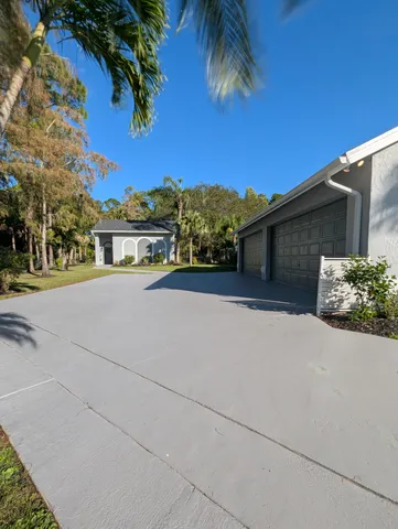 an empty room with windows and entryway