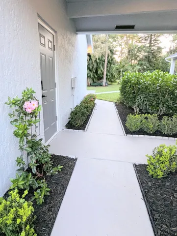 a view of an empty room with glass door