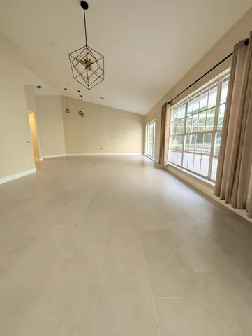 a bathroom with a granite countertop double vanity sink and mirror