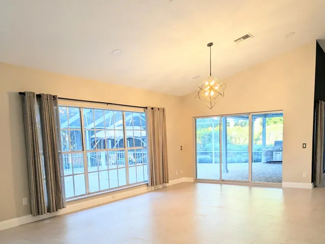 a spacious bathroom with a double vanity sink and a mirror