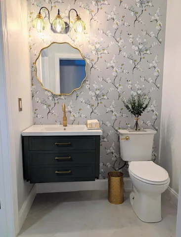 a view of a livingroom with a ceiling fan and window