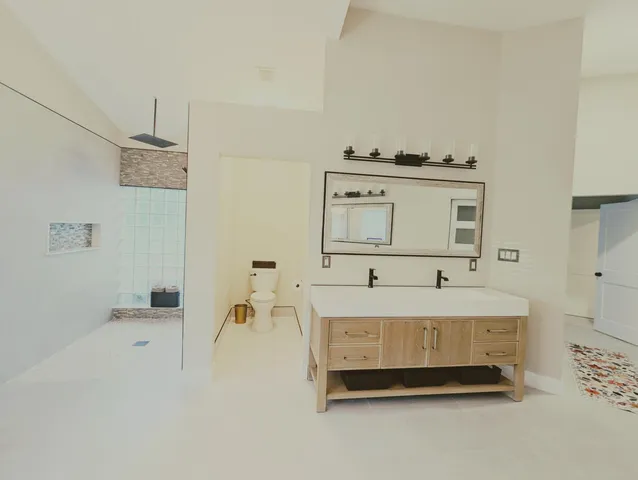 a view of swimming pool with palm trees