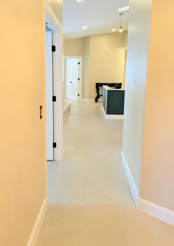 a bathroom with a sink a toilet a mirror and shower