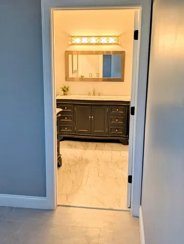 a backyard of a house with fire pit and outdoor seating