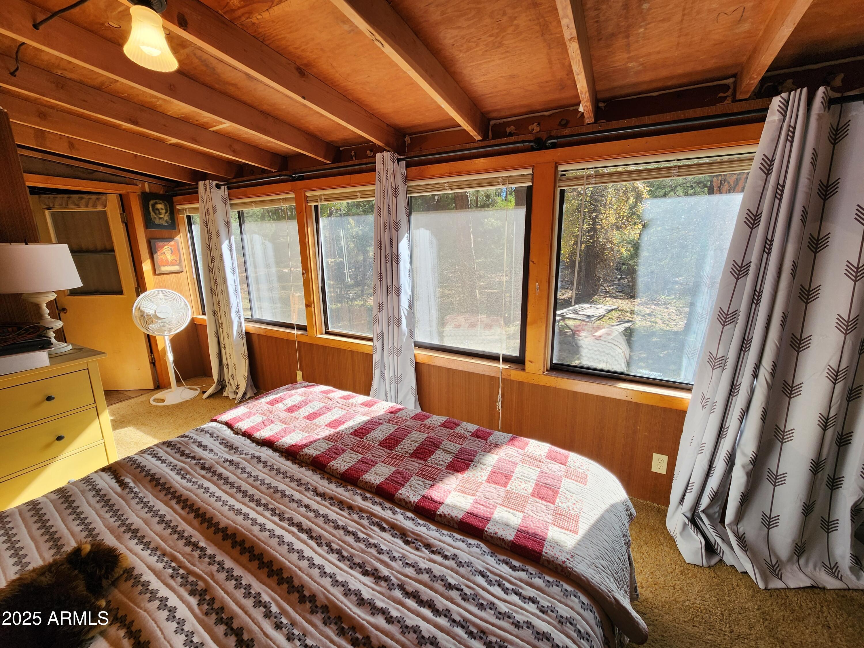 247 West Diamond Road Payson, AZ 85541 - Photo 32 of 42 a bedroom with a bed and wooden floor