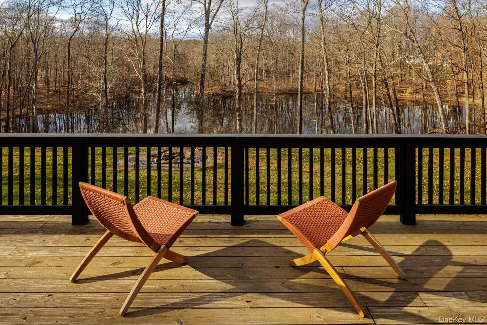 407 White Schoolhouse Road Rhinebeck, NY 12572 - Photo 11 of 17 a balcony with wooden floor and outdoor seating