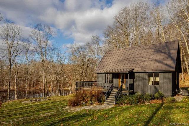 a front view of a building with a garden