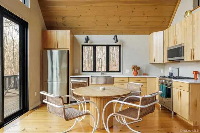 a dining room with furniture and a window