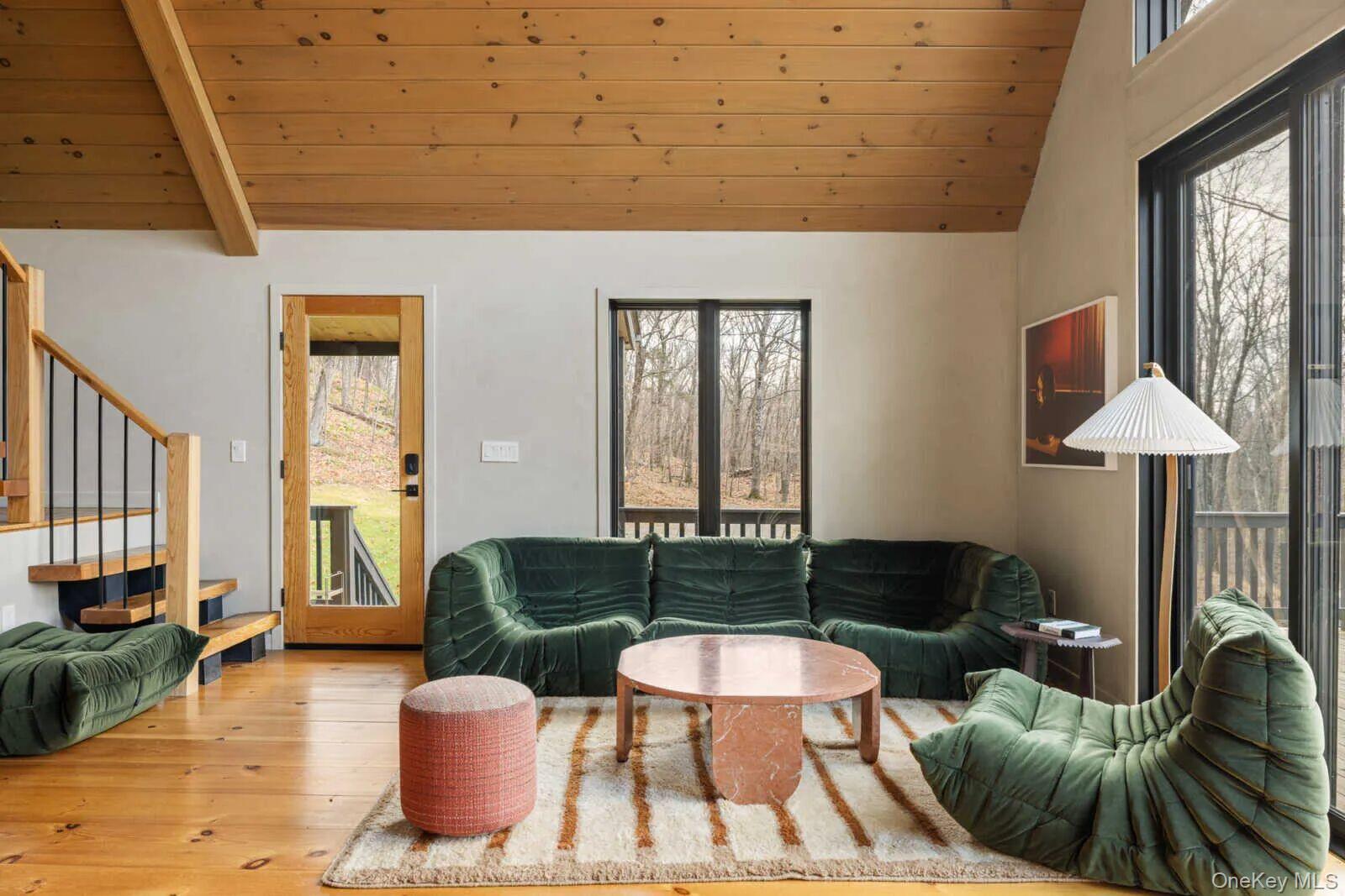 407 White Schoolhouse Road Rhinebeck, NY 12572 - Photo 4 of 17 a living room with furniture and a large window