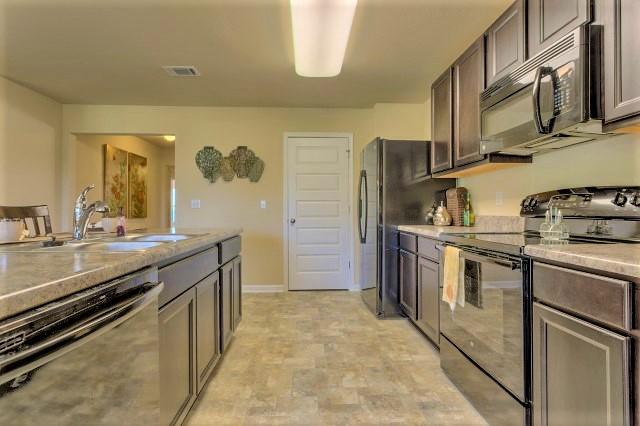 717 Widgeon Way Crestview, FL 32539 - Photo 3 of 19 Aria kitchen 2