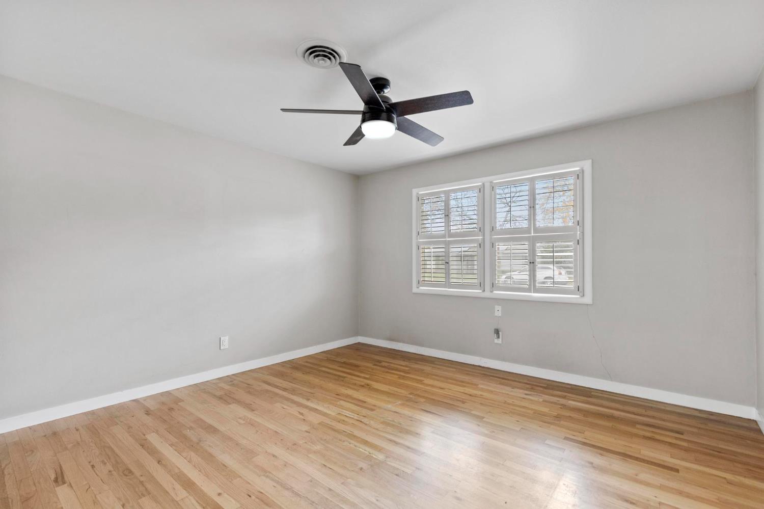 731 Sioc Street Colusa, CA 95932 - Photo 13 of 30 wooden floor in an empty room with a window