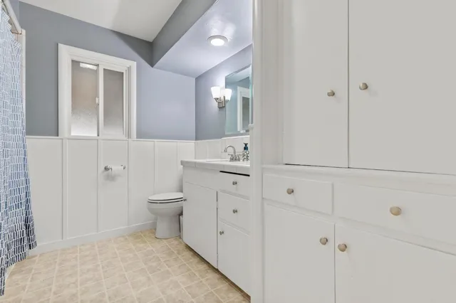 a front view of a house with swimming pool having outdoor seating