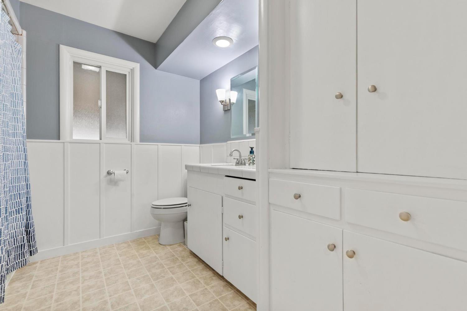 731 Sioc Street Colusa, CA 95932 - Photo 15 of 30 a bathroom with a toilet sink and mirror