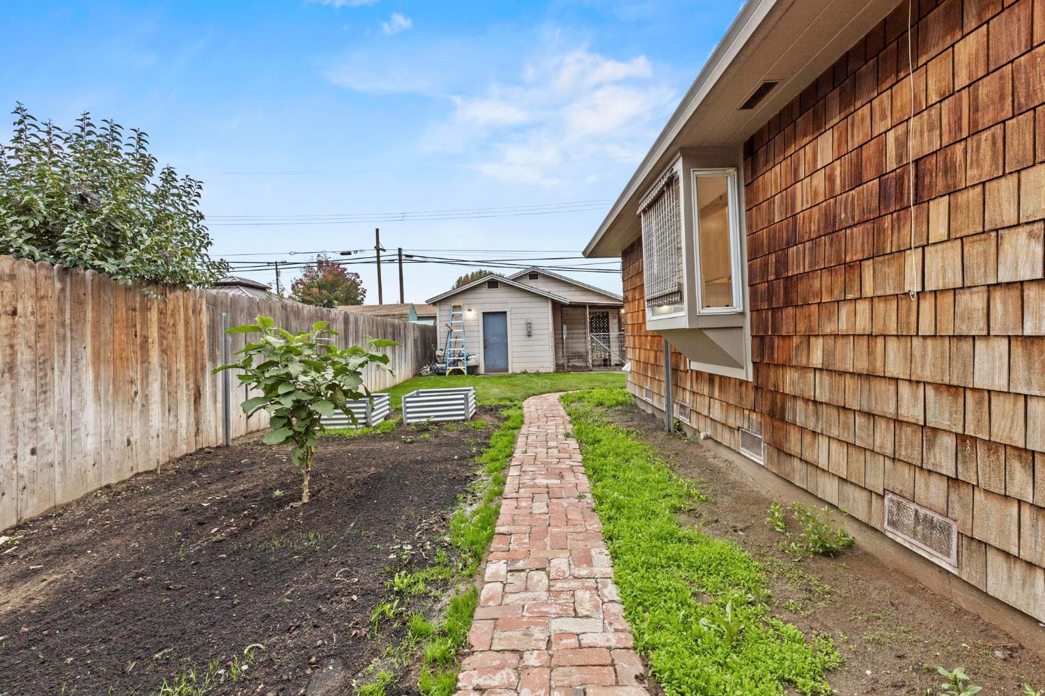 731 Sioc Street Colusa, CA 95932 - Photo 23 of 30 a view of a house with a small yard and wooden fence