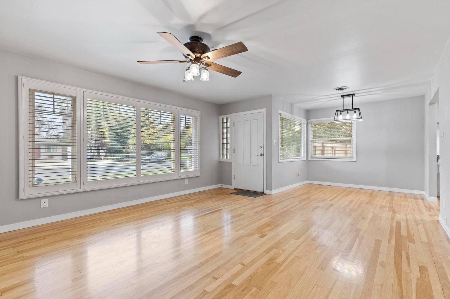 731 Sioc Street Colusa, CA 95932 - Photo 3 of 30 a view of an empty room with a window and wooden floor