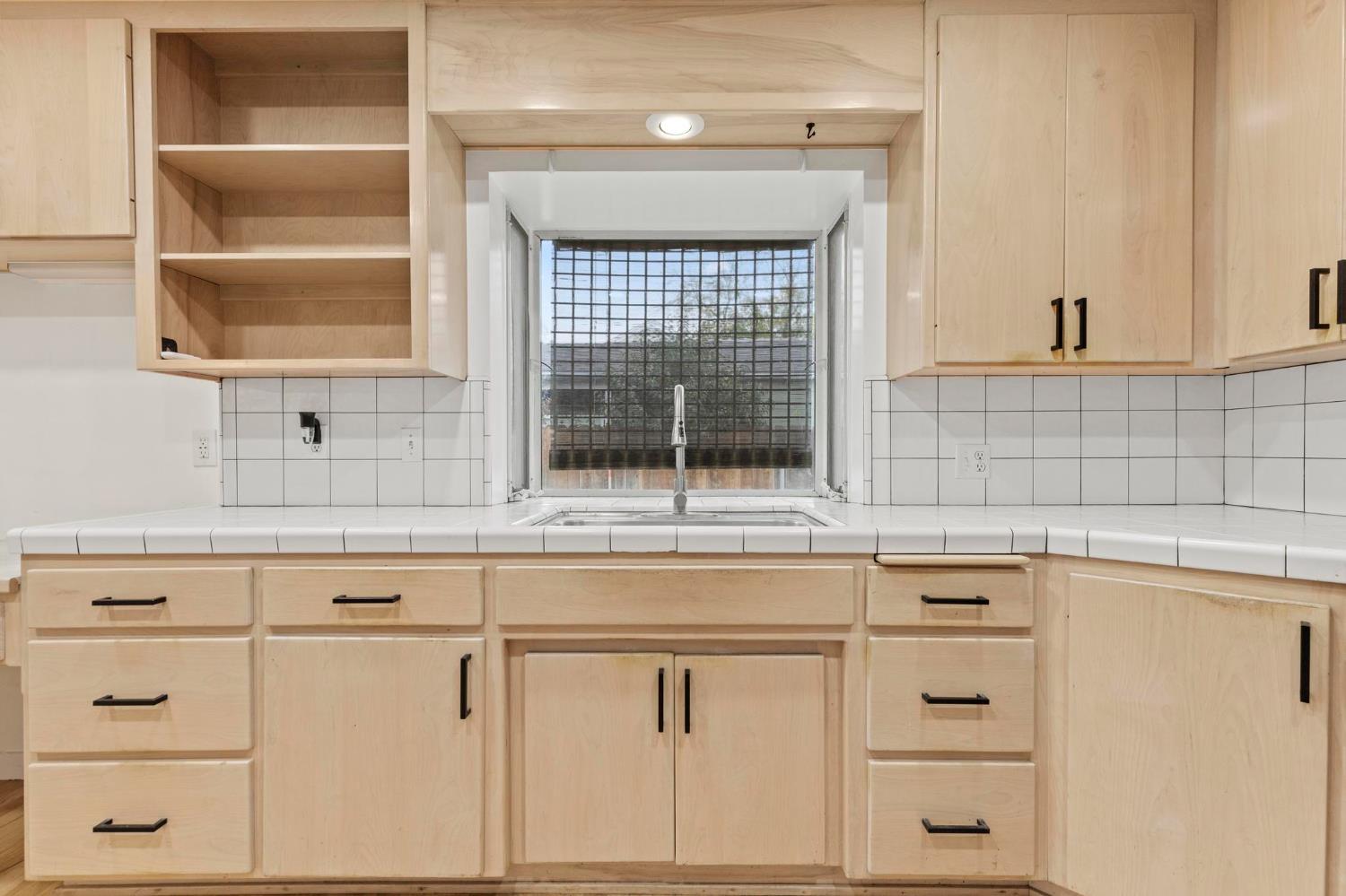 731 Sioc Street Colusa, CA 95932 - Photo 8 of 30 a view of white cabinets and a wooden floor
