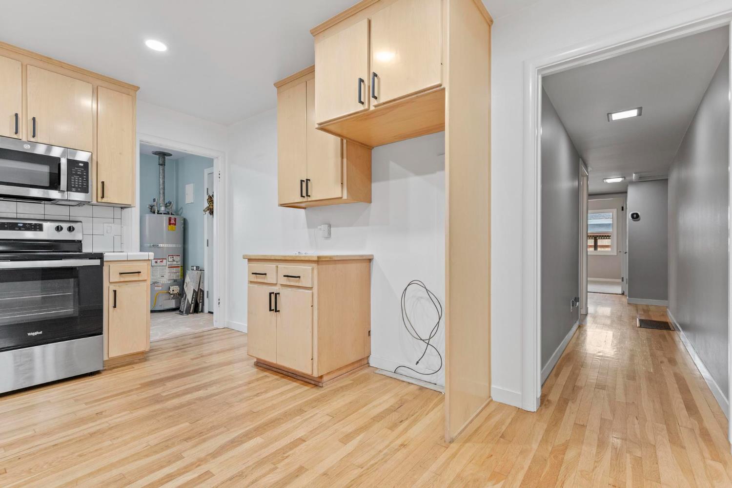 731 Sioc Street Colusa, CA 95932 - Photo 10 of 30 a kitchen with stainless steel appliances a stove top oven a sink and a refrigerator