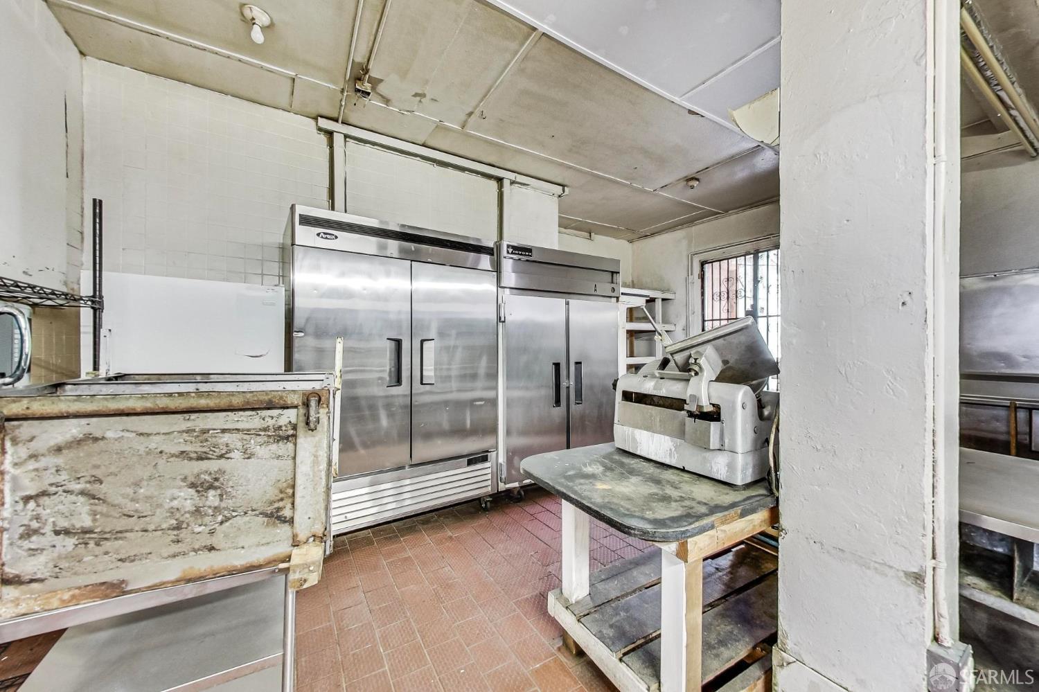 2811-2815 Telegraph Avenue Berkeley, CA 94705 - Photo 12 of 73 a kitchen with stainless steel appliances granite countertop a stove and a refrigerator