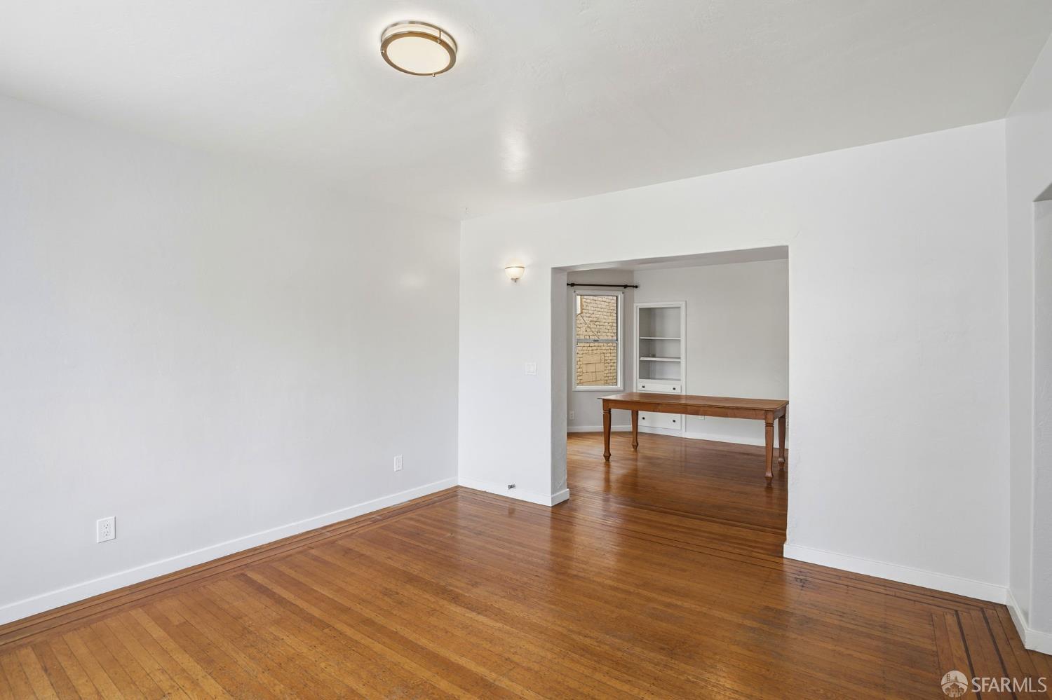 2811-2815 Telegraph Avenue Berkeley, CA 94705 - Photo 22 of 73 a view of empty room with wooden floor and fan