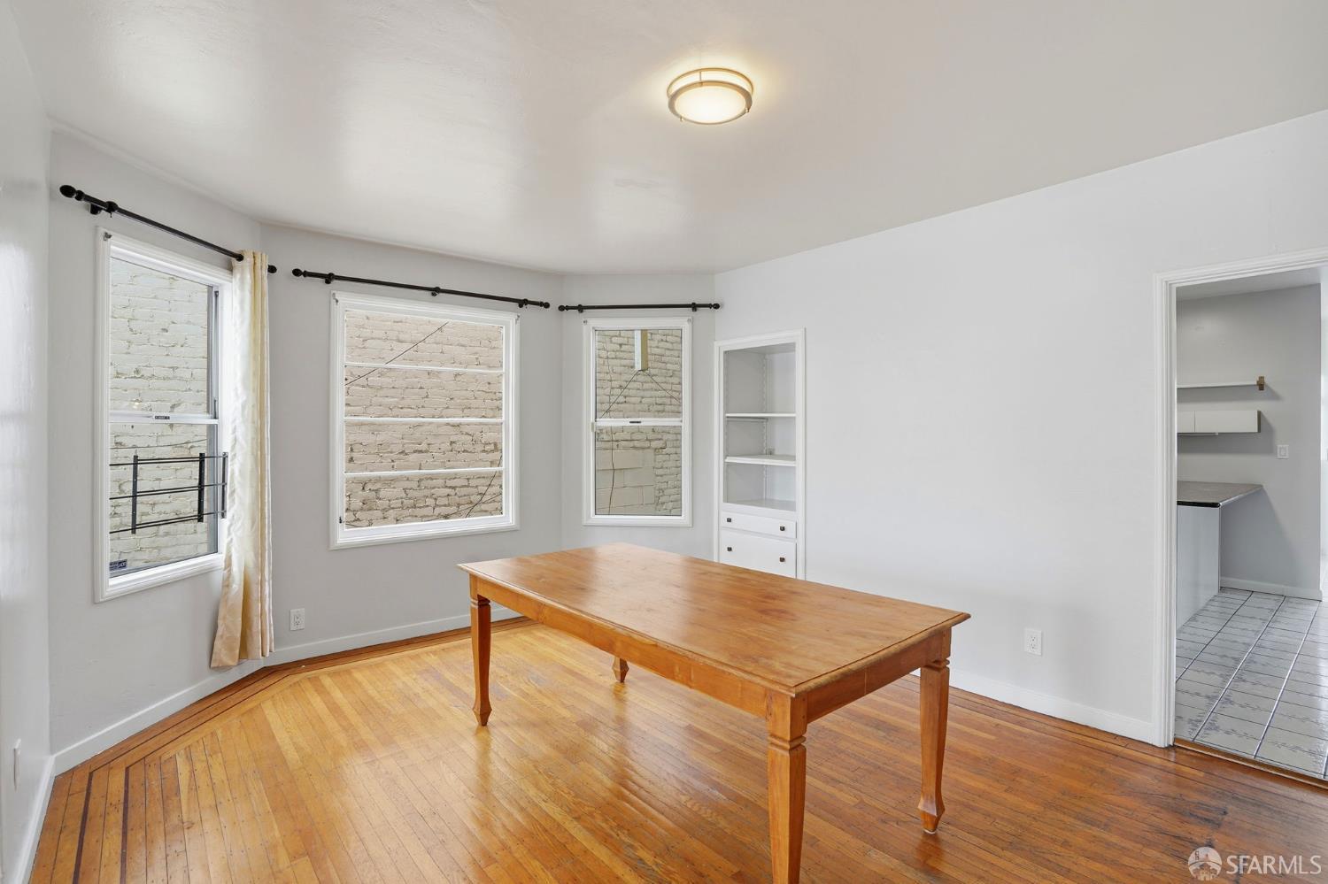 2811-2815 Telegraph Avenue Berkeley, CA 94705 - Photo 28 of 73 wooden floor in an empty room with a window