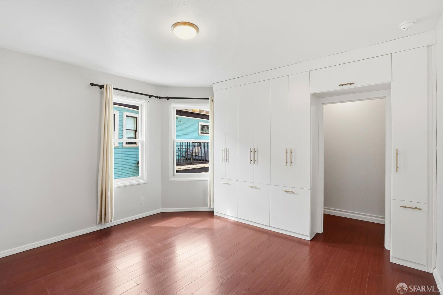 2811-2815 Telegraph Avenue Berkeley, CA 94705 - Photo 30 of 73 an empty room with wooden floor and windows