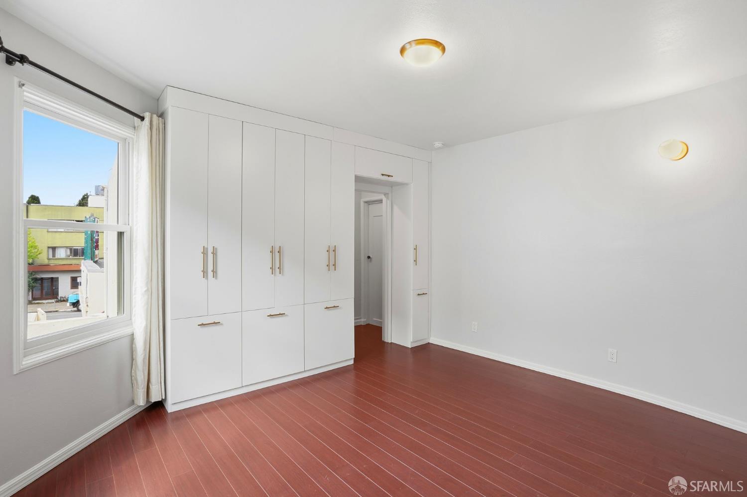 2811-2815 Telegraph Avenue Berkeley, CA 94705 - Photo 31 of 73 an empty room with wooden floor and windows