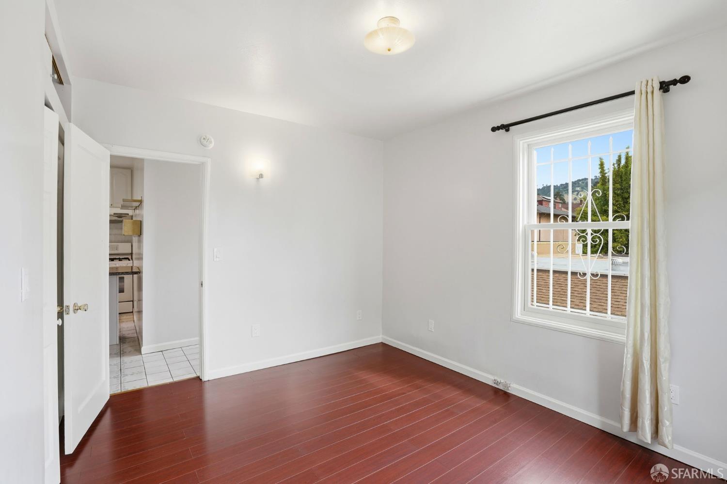 2811-2815 Telegraph Avenue Berkeley, CA 94705 - Photo 34 of 73 wooden floor in an empty room with a window