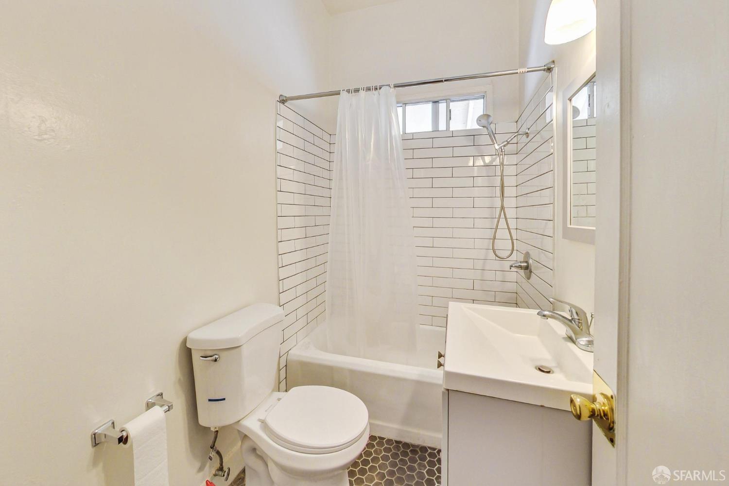 2811-2815 Telegraph Avenue Berkeley, CA 94705 - Photo 50 of 73 a bathroom with a toilet a sink and a bathtub