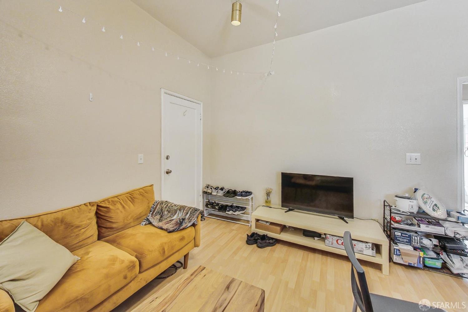 2811-2815 Telegraph Avenue Berkeley, CA 94705 - Photo 54 of 73 a living room with furniture and a flat screen tv