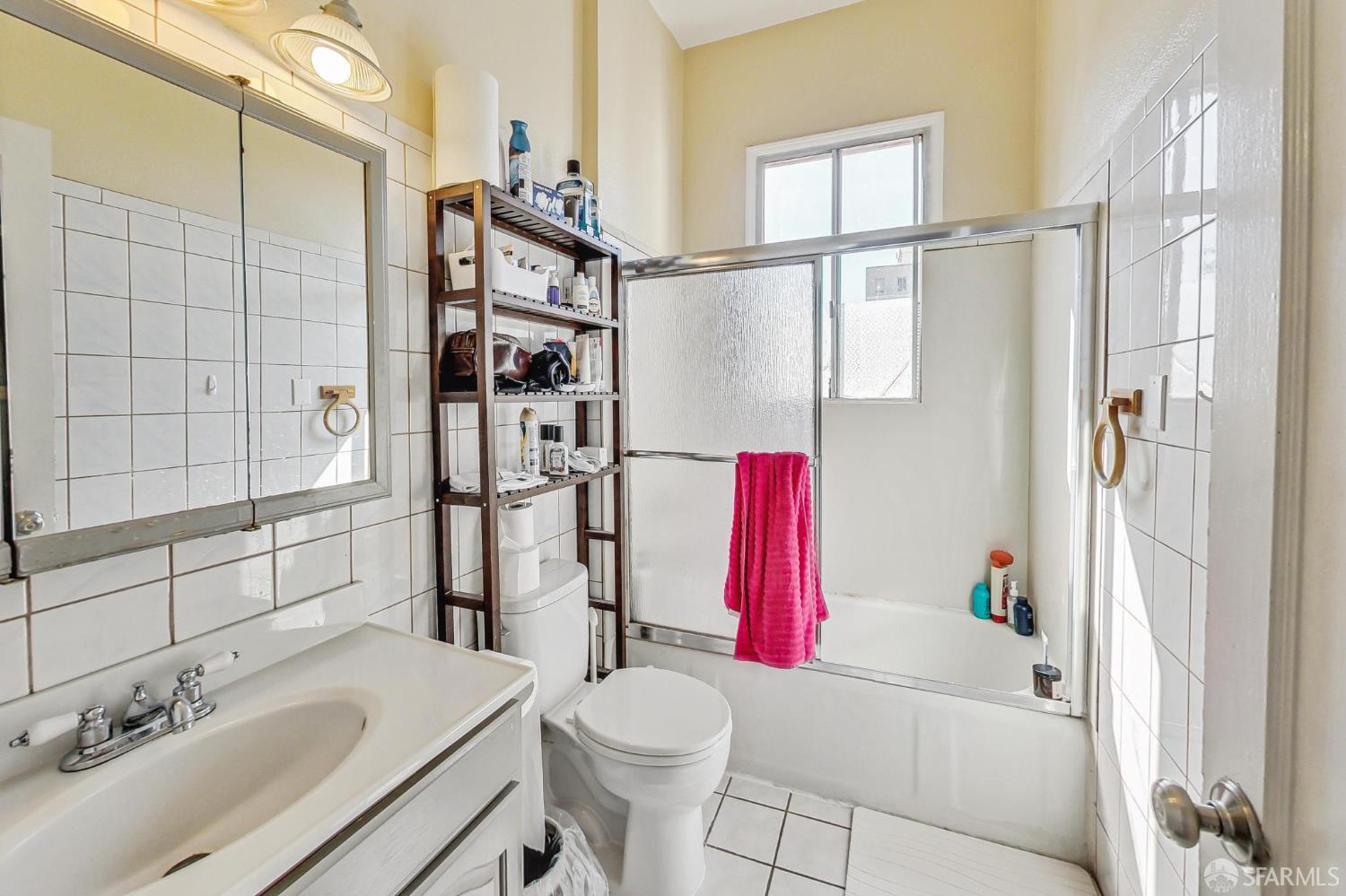2811-2815 Telegraph Avenue Berkeley, CA 94705 - Photo 64 of 73 a bathroom with a sink vanity mirror and shower