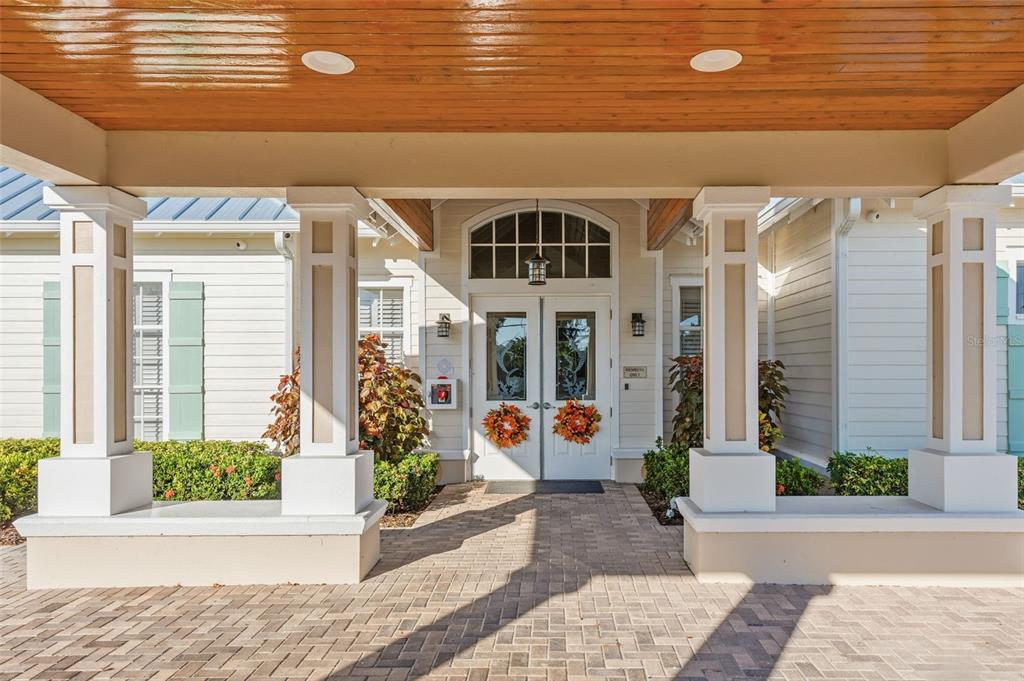 10311 Lands End Circle, Unit 16 Placida, FL 33946 - Photo 56 of 76 a front view of a building with potted plants