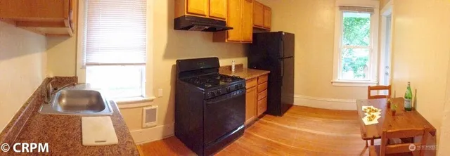 a kitchen with a sink and a refrigerator