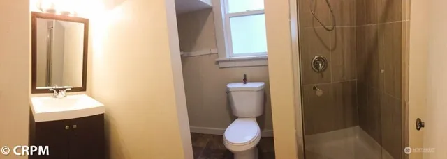 a bathroom with a toilet and a sink