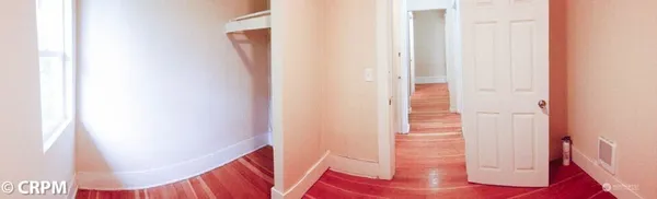 a view of a hallway with staircase