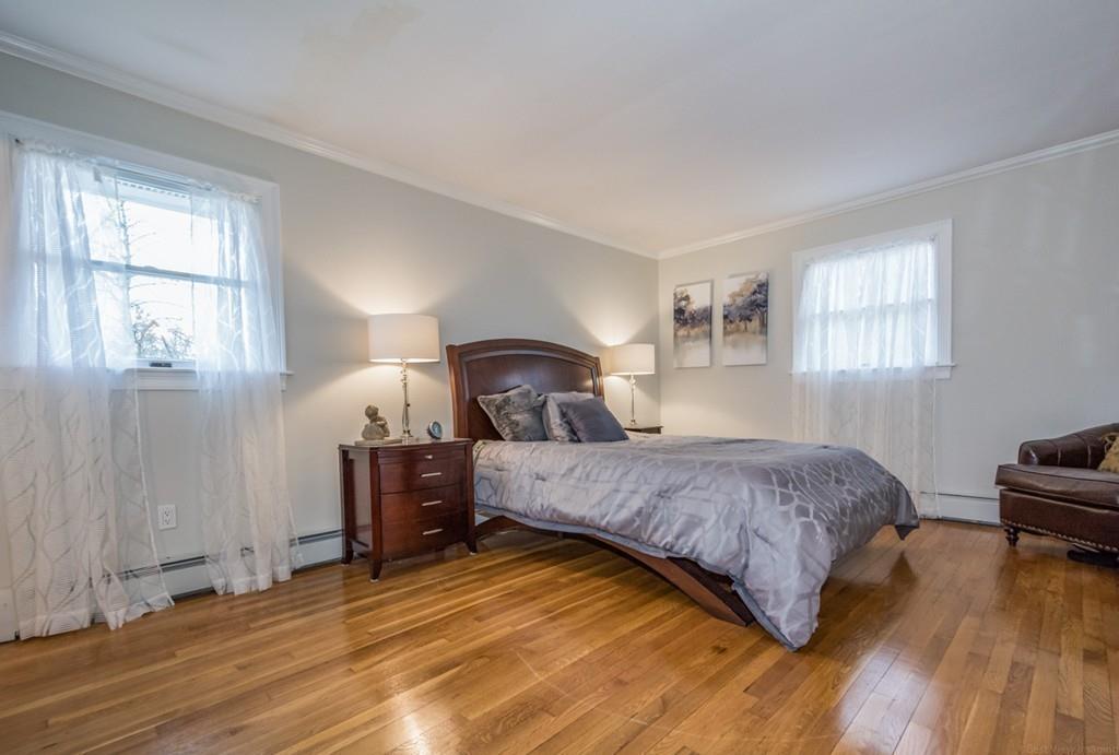 35 Barton Road Stow, MA 01775 - Photo 11 of 28 a bedroom with a bed and wooden floor