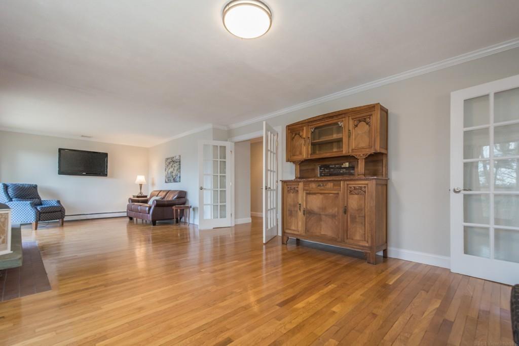 35 Barton Road Stow, MA 01775 - Photo 8 of 28 a view of livingroom with furniture and flat screen tv