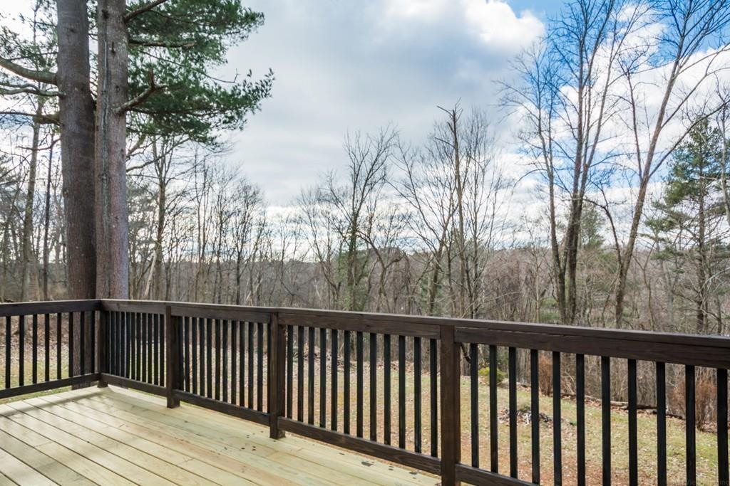 35 Barton Road Stow, MA 01775 - Photo 10 of 28 a balcony with wooden floor and fence