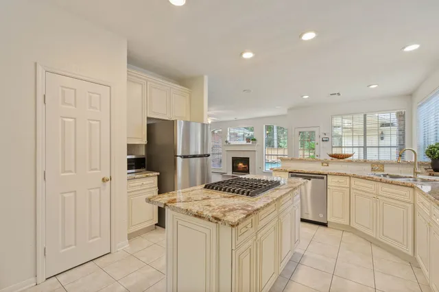 a kitchen with a sink stove and refrigerator