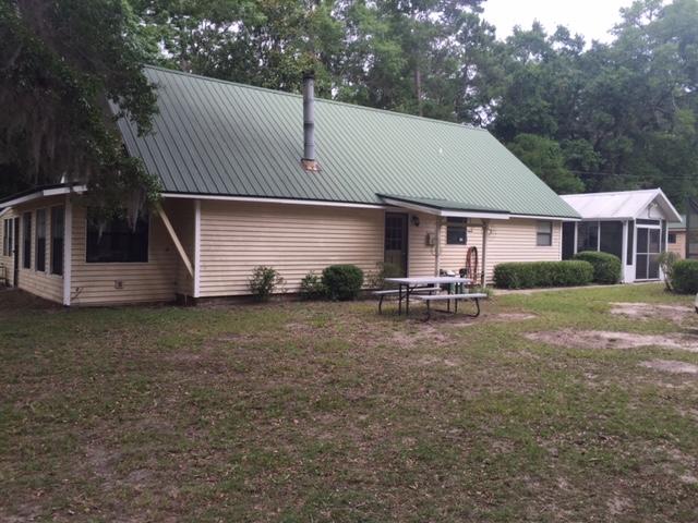 692 Piney Point Road Freeport, FL 32439 - Photo 1 of 17 a house view with a garden space