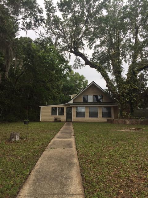 692 Piney Point Road Freeport, FL 32439 - Photo 2 of 17 a front view of a house with garden