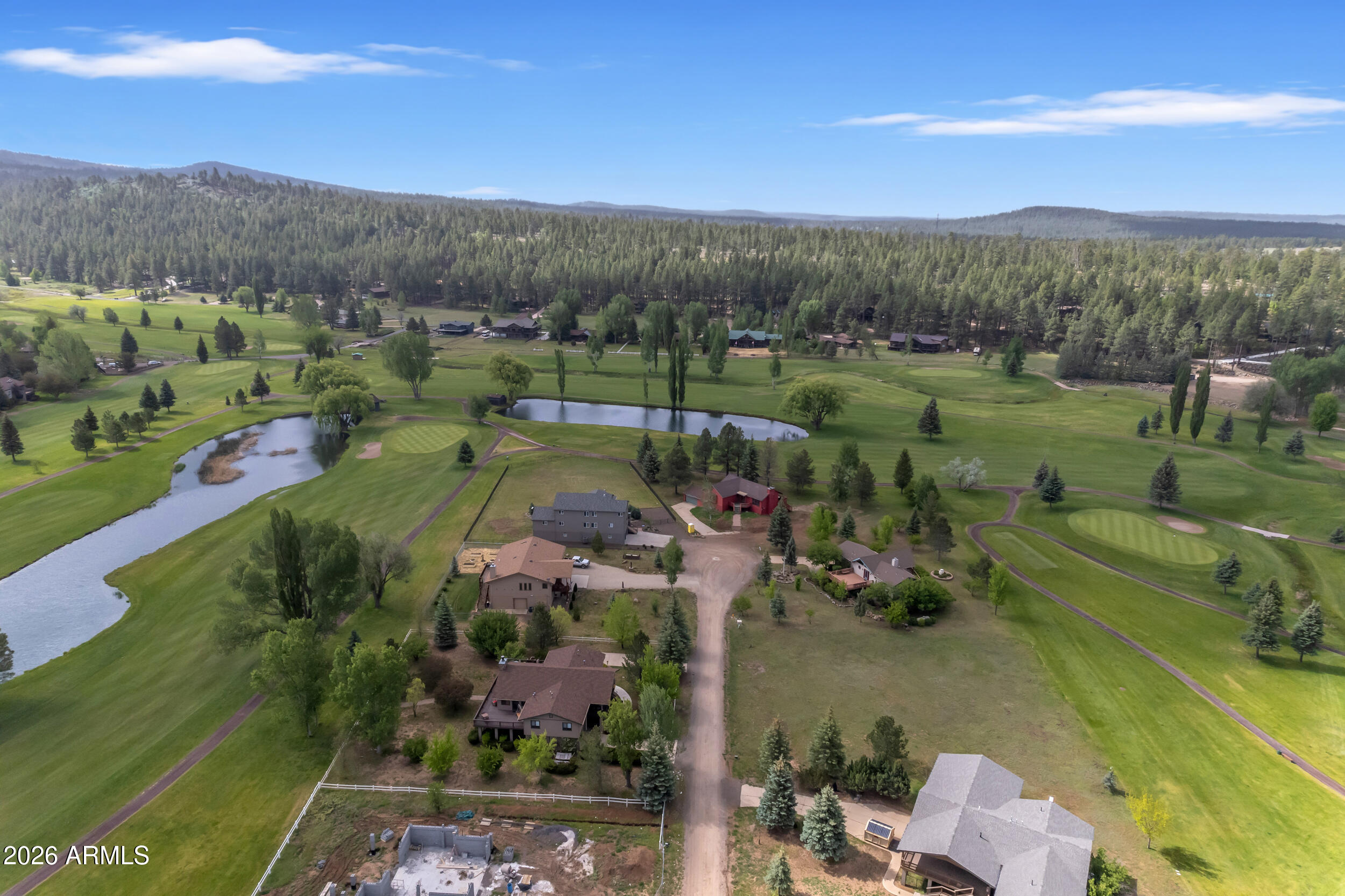 17975 Hopi Road Munds Park, AZ 86017 - Photo 55 of 58 an aerial view of a golf course with parking space